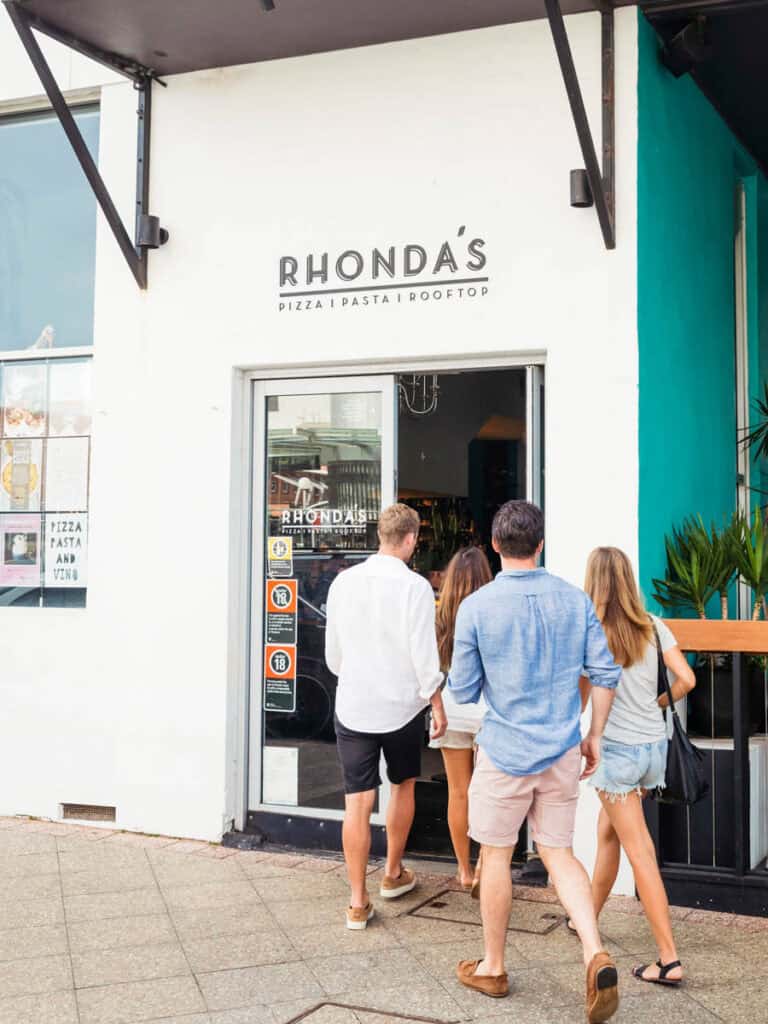 Friends entering Rhonda's Restaurant & Bar, Terrigal.