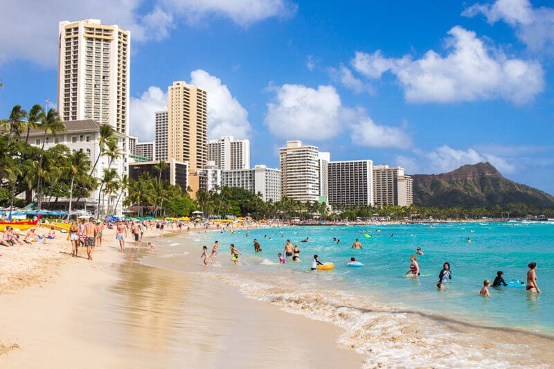 people swimming in waikiki beach