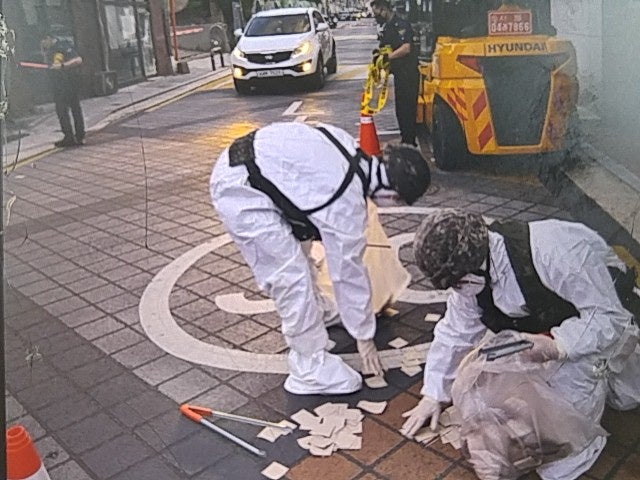 South Korean soldiers check a balloon carrying garbage, presumably sent by North Korea