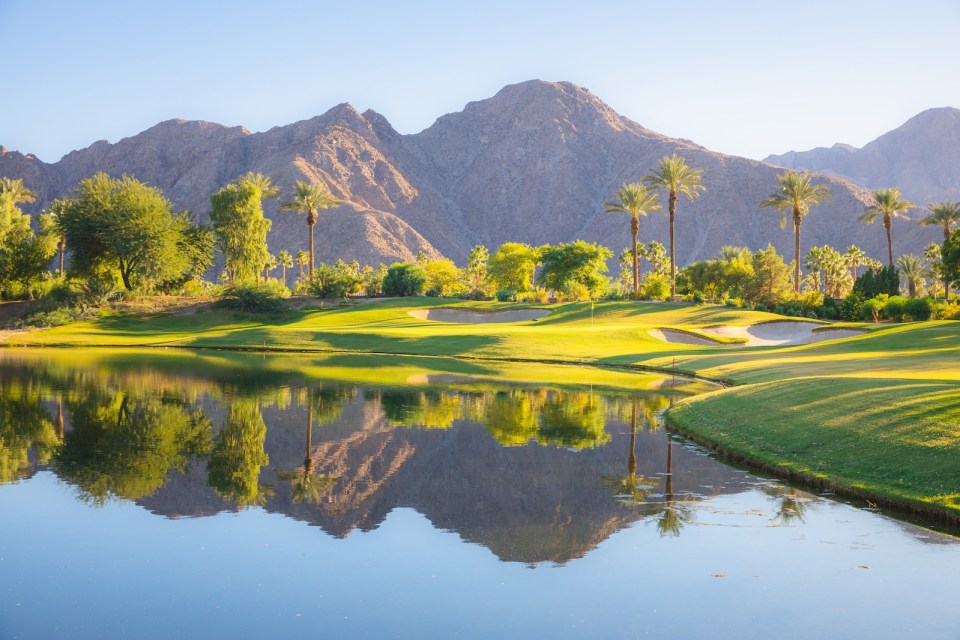 Beautiful golden light over Indian Wells Golf Resort, a desert golf course in Palm Springs, California, USA with view of the San Bernadino Mountains.