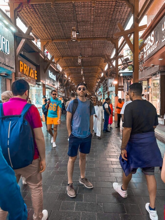 Kyle Kroeger at the Dubai Gold Souk shopping scene with diverse crowd and traditional market ambiance