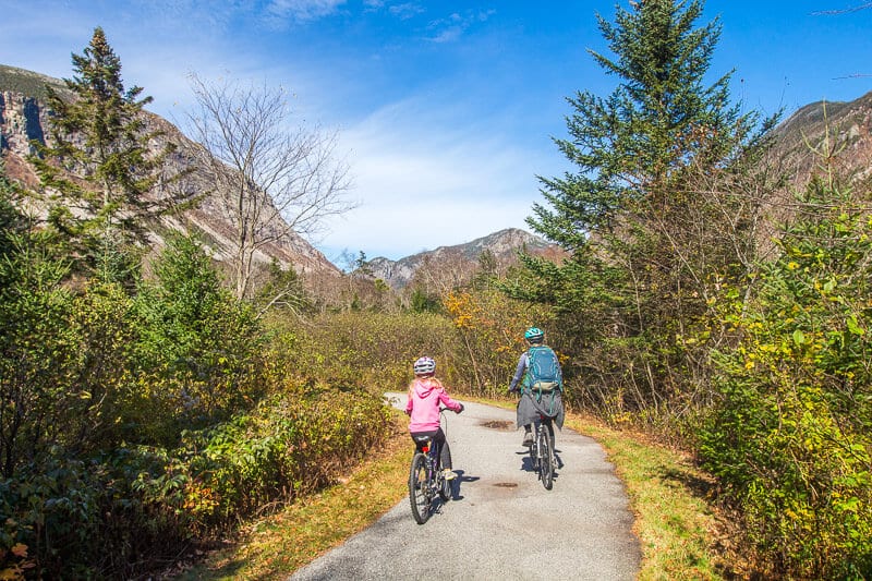 mother and child biking on White mountains bike trail