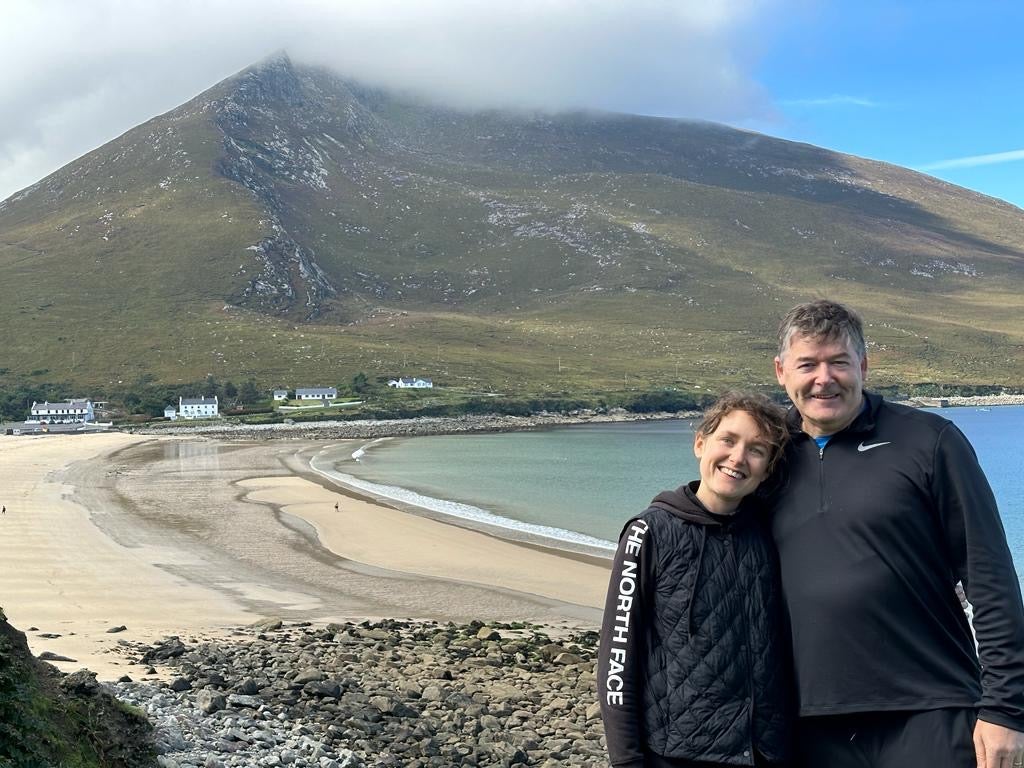Aisling and her dad, with Golden Strand beach behind them