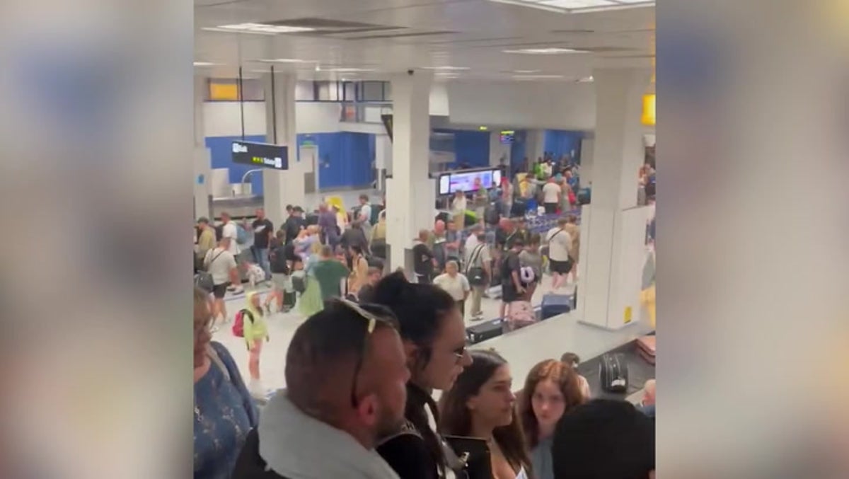 Large crowds at Manchester airport baggage claim after major power cut | News