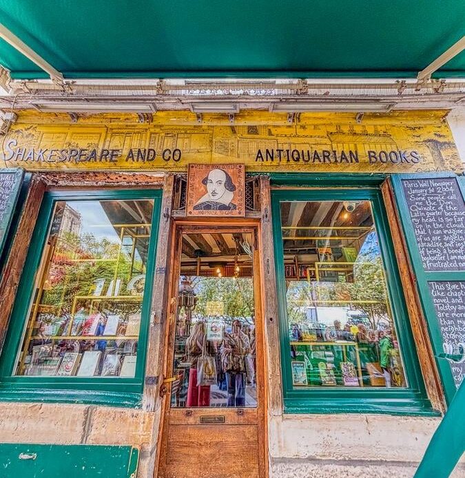 Historic entrance of Shakespeare and Company bookstore in Paris, showcasing its antiquarian charm
