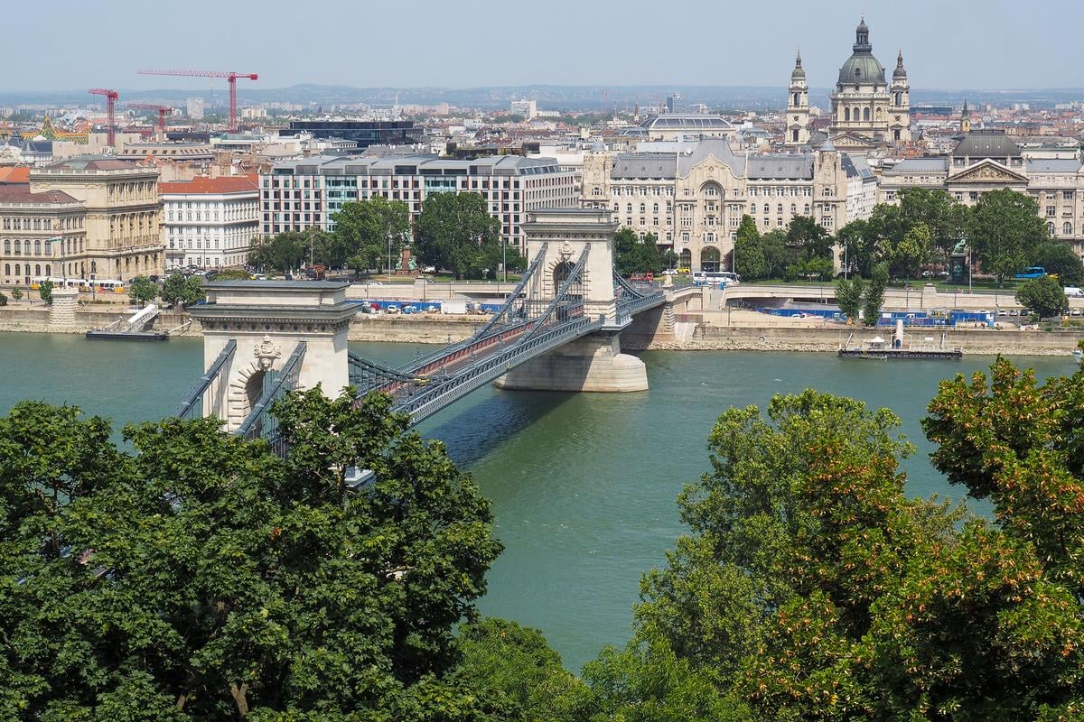 Panoramic view of Széchenyi Chain Bridge over the Danube River in Budapest, showcasing historical architecture