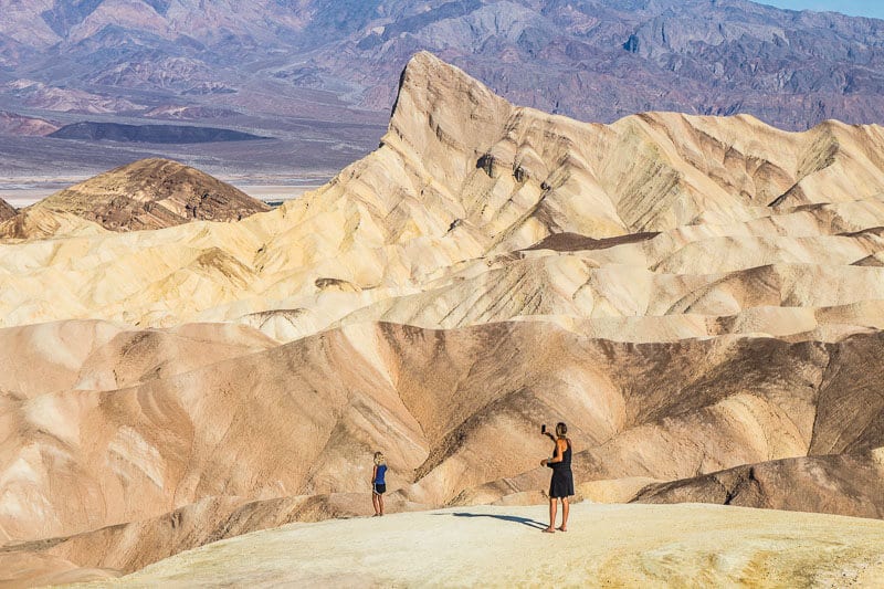 woman looking at view of Zabriskie point death valley