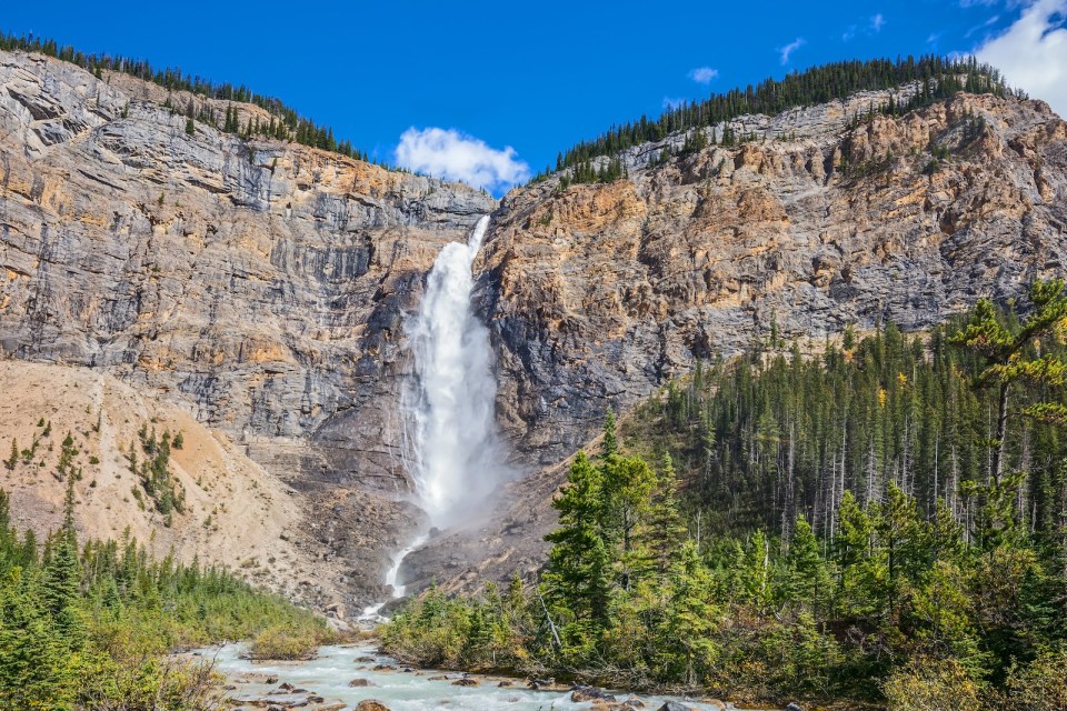 Yoho National Park. Autumn full-flowing waterfall Takakkaw. Rocky Mountains of Canada