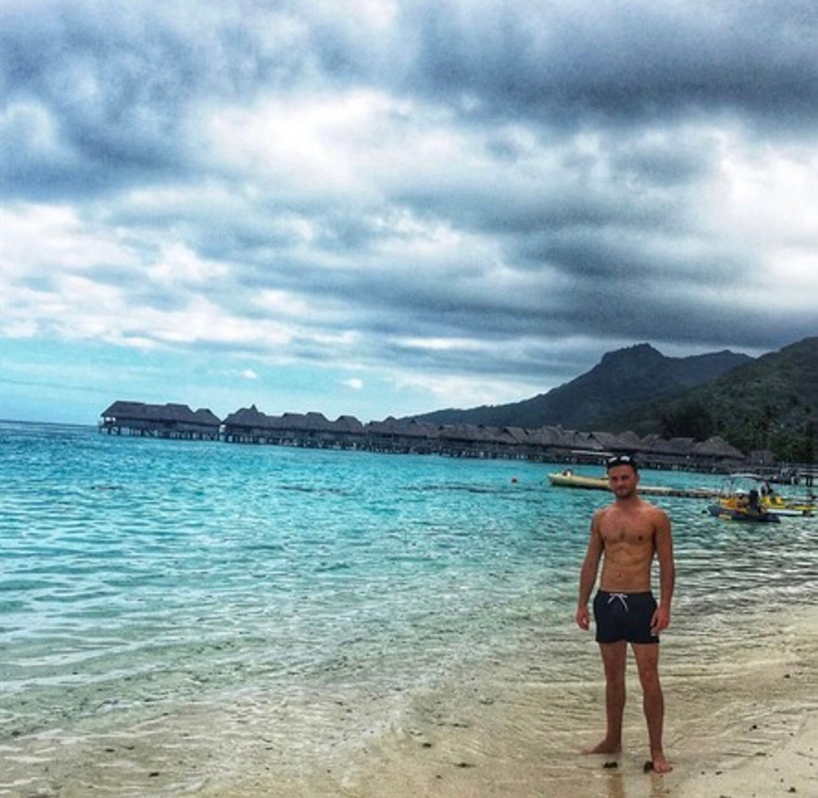 Jack soaks up the scenery on a beach in the Pacific