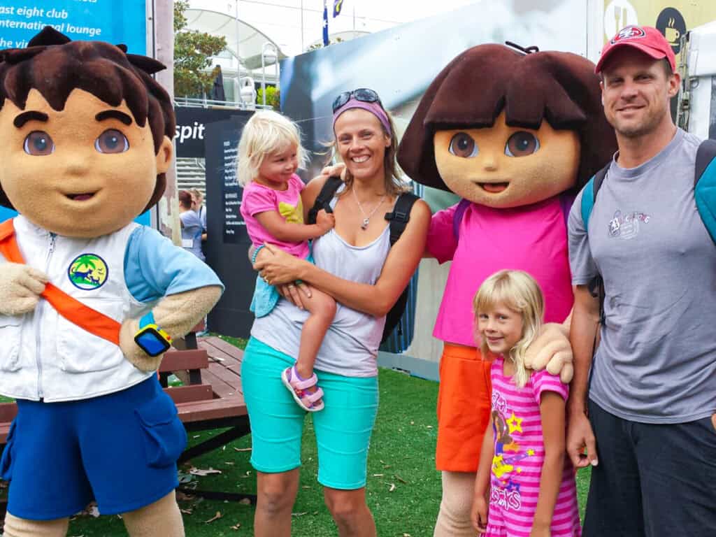 family posing with dora the explorer character at australian open