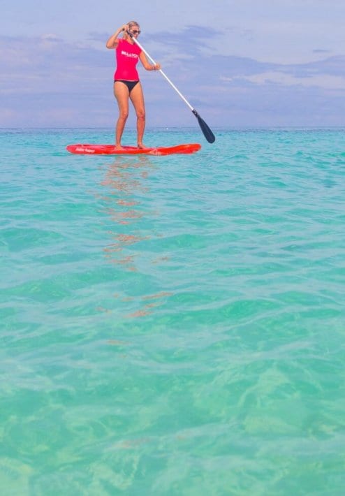 woman on paddle board on Punta Bunga Beach