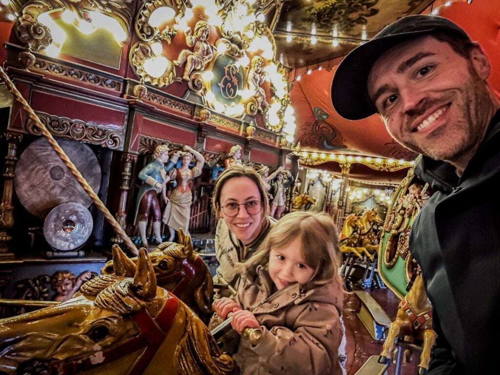 Joyful family carousel ride at Efteling Theme Park, Netherlands