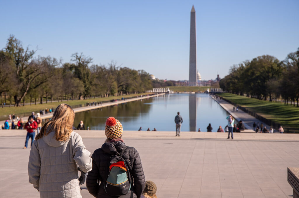 Mom and daughters looking out over the National Mall in DC