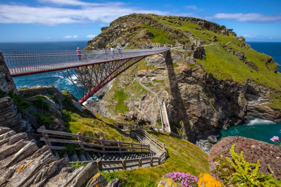 A view of the stunning bridge and picturesque scenery at Tintagel Castle in Cornwall, UK.