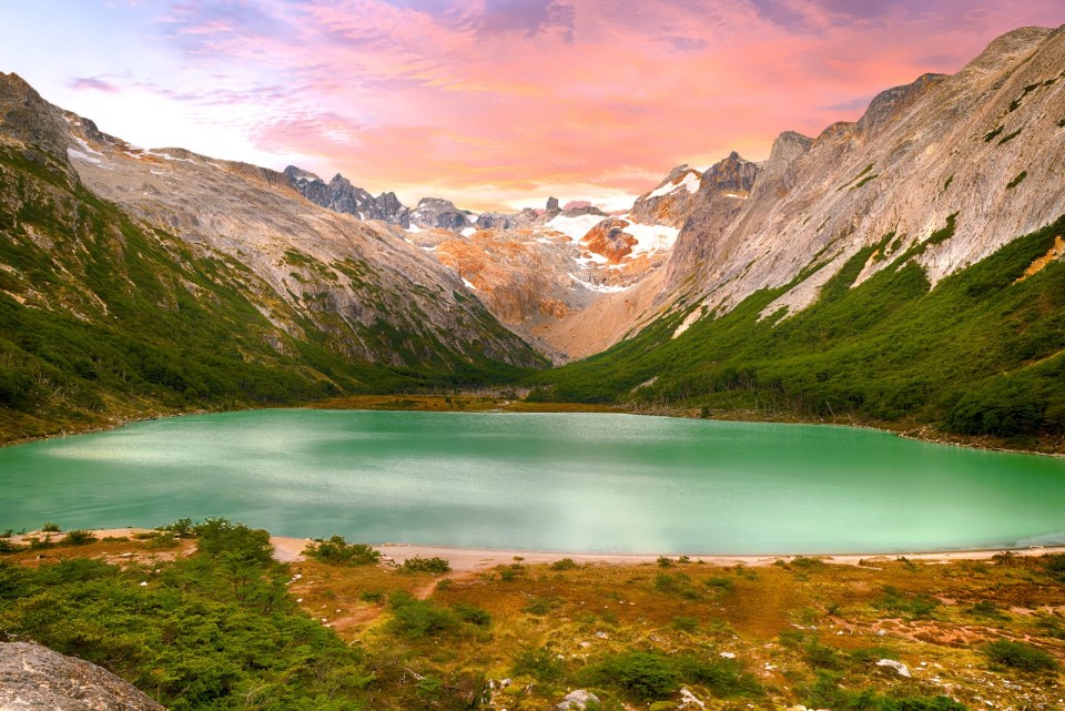 Sunset over Andes mountains and lake Laguna Esmeralda near Ushuaia in Tierra del Fuego, Argentina