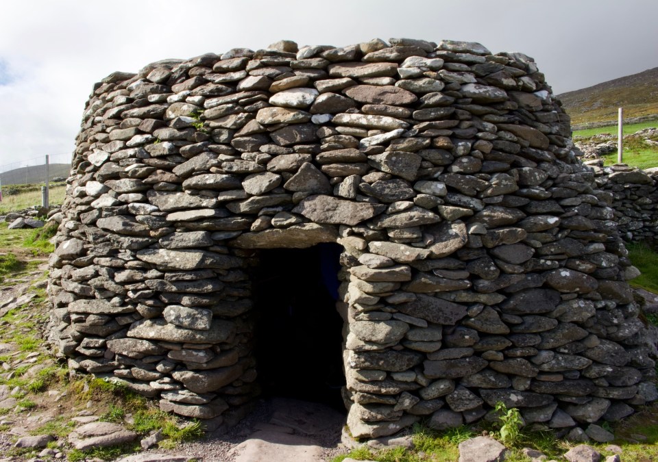 Close up view of a dry stone clochan (beehive hut) on the Dingle Peninsula in County Kerry, Ireland