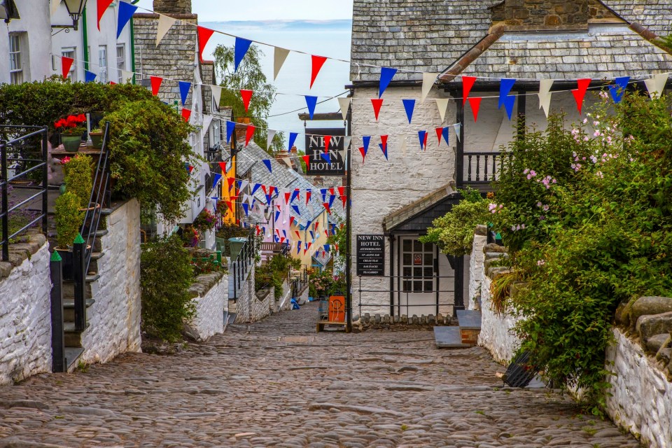 A view down the picturesque cobbled main street of the fishing village of Clovelly in North Devon, UK.