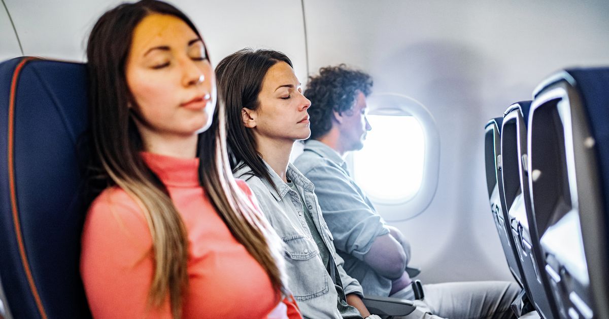 Airplane Armrest Etiquette, According To Experts