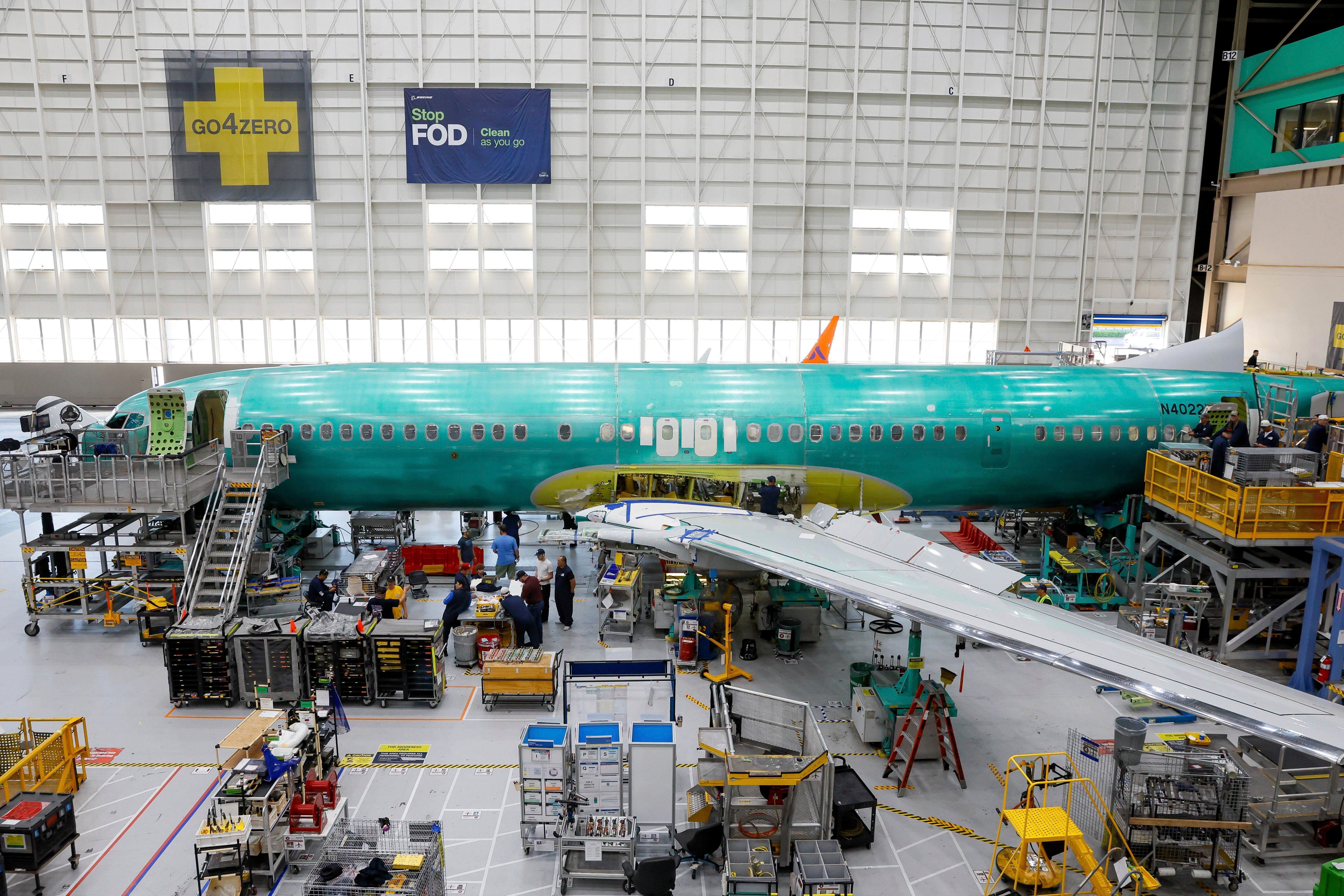 A Boeing 737 MAX aircraft is shown on the assembly line during a brief media tour at the Boeing facility in Renton, Washington