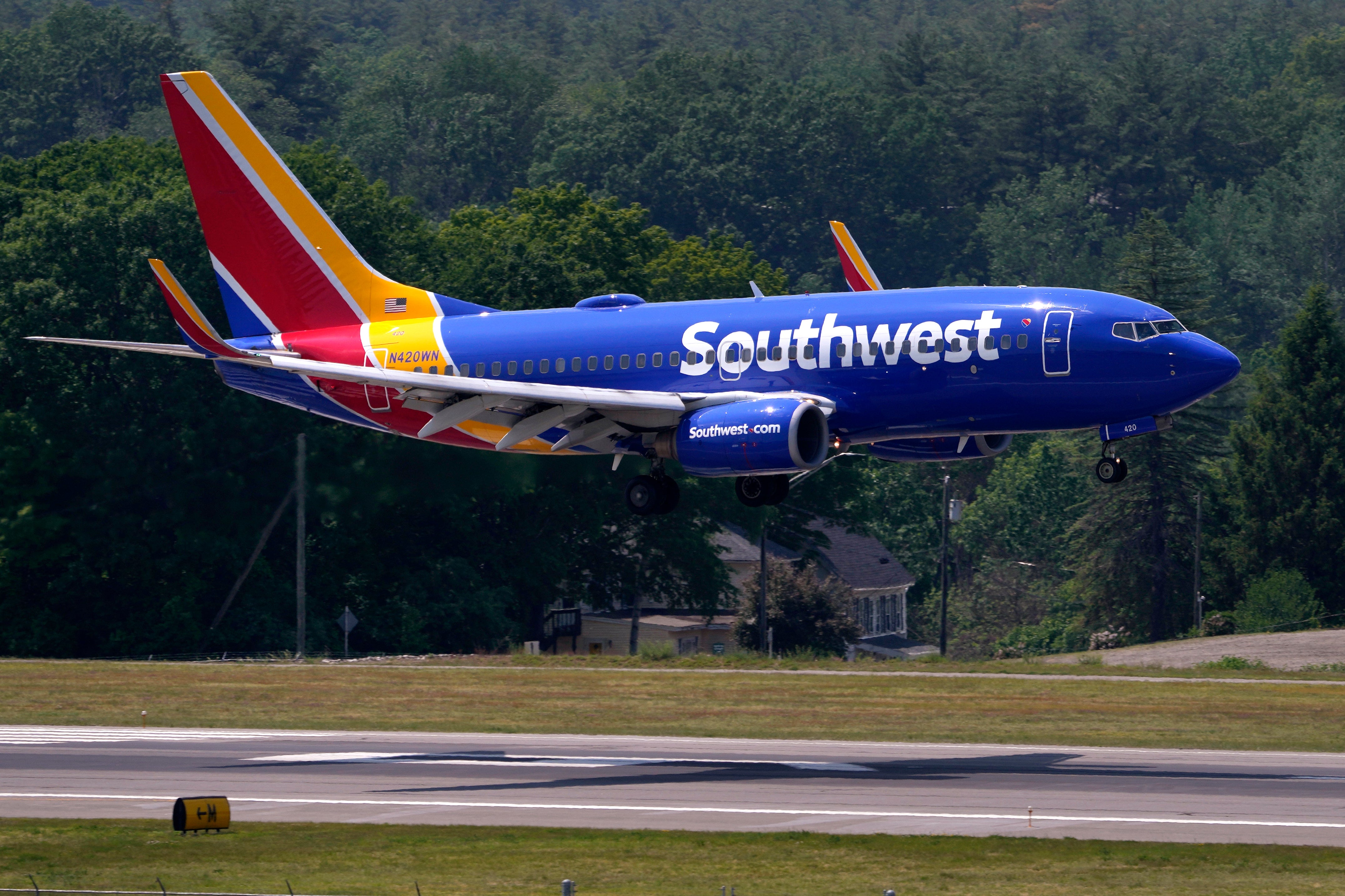 A Southwest Airlines Boeing 737 lands at Manchester-Boston Regional Airport. The airline says it is aware of a series of incidents relating to exploding cans