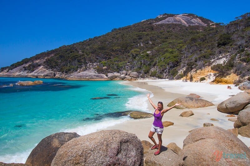 woman standing on rock on Waterfall Beach, Albany, Western Australia