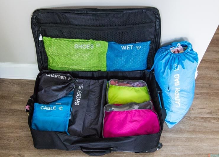 suitcase neatly arranged into packing cells