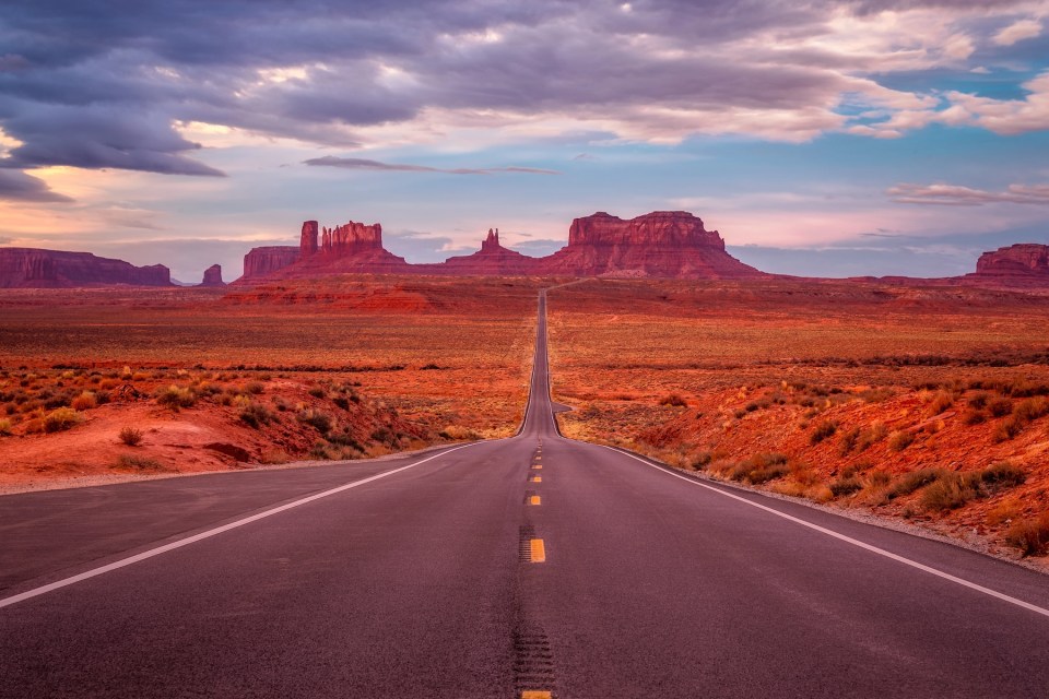 Amazing sunrise with pink, gold and magenta colors near Monument Valley, Arizona, USA