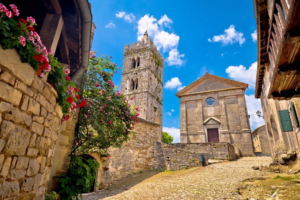 Town of Hum old cobbled square and church view, region of Istria, Croatia