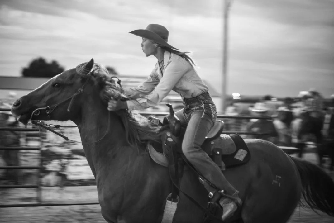 A cowgirl rides with some giddyap.