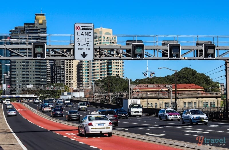 A car driving on a city street filled with lots of traffic