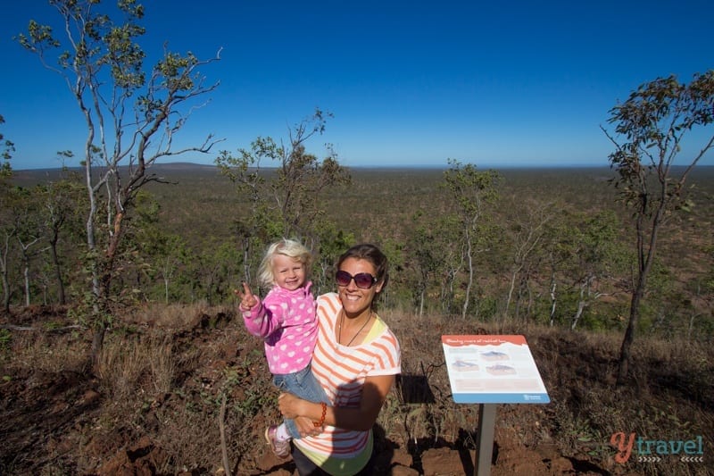 woman holding a child outside