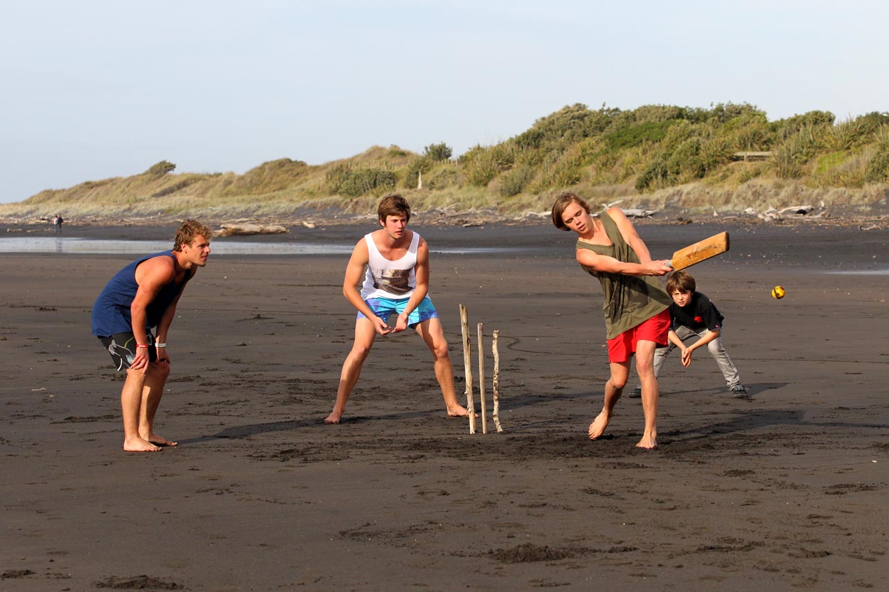 Beach cricket on black sand of Weld Rd. Beach, Taranaki.