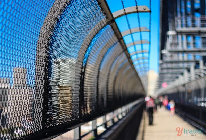 a metal fence on a bridge