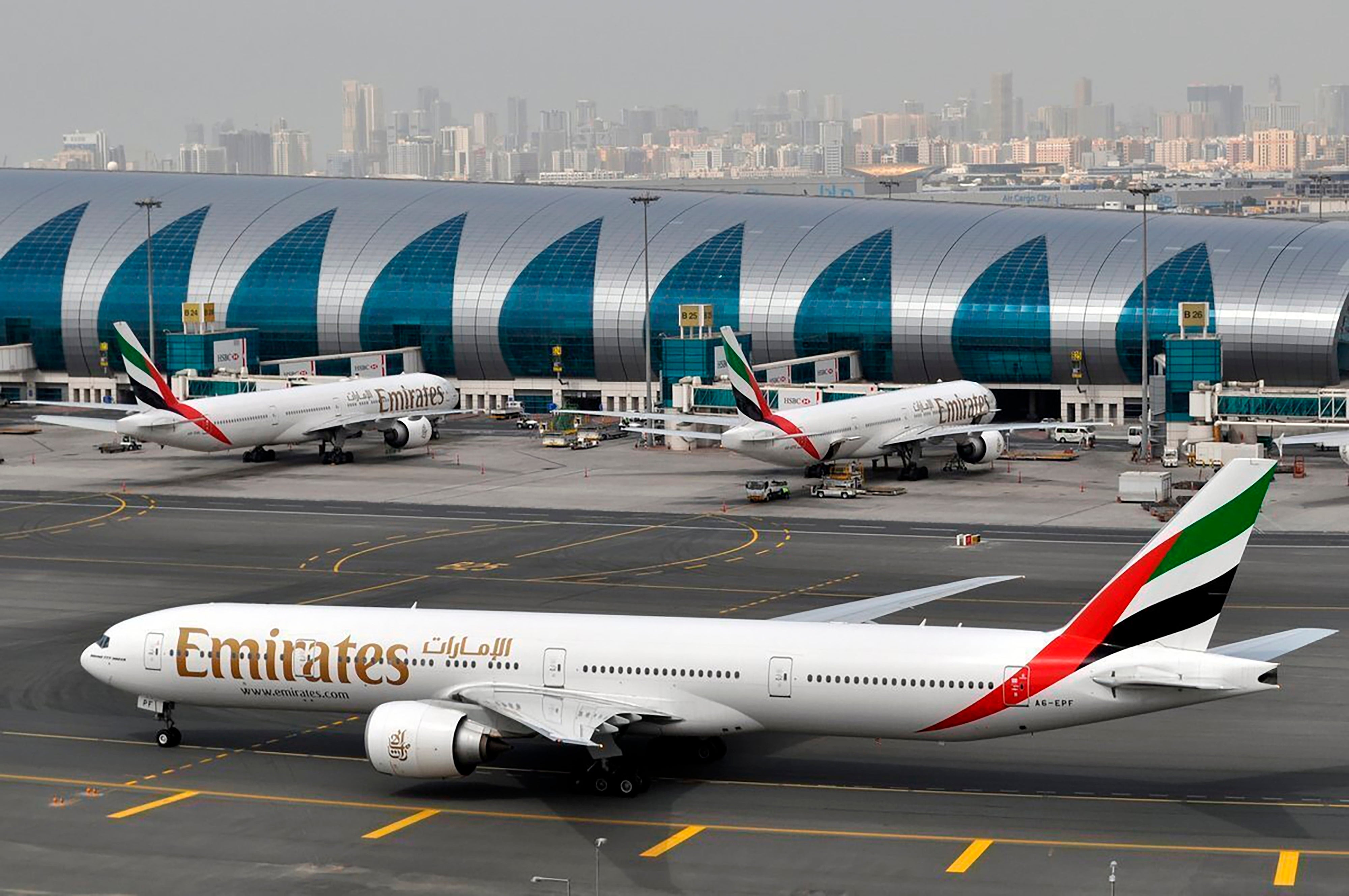 an Emirates plane taxis to a gate at Dubai International Airport at Dubai International Airport in Dubai, United Arab Emirates, March 22, 2017. (AP Photo/Adam Schreck, File)