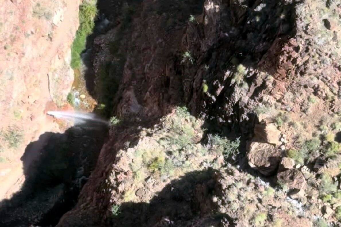 Water can be seen shooting out of a pipeline that broke along the North Kaibab Trail in the Grand Canyon National Park