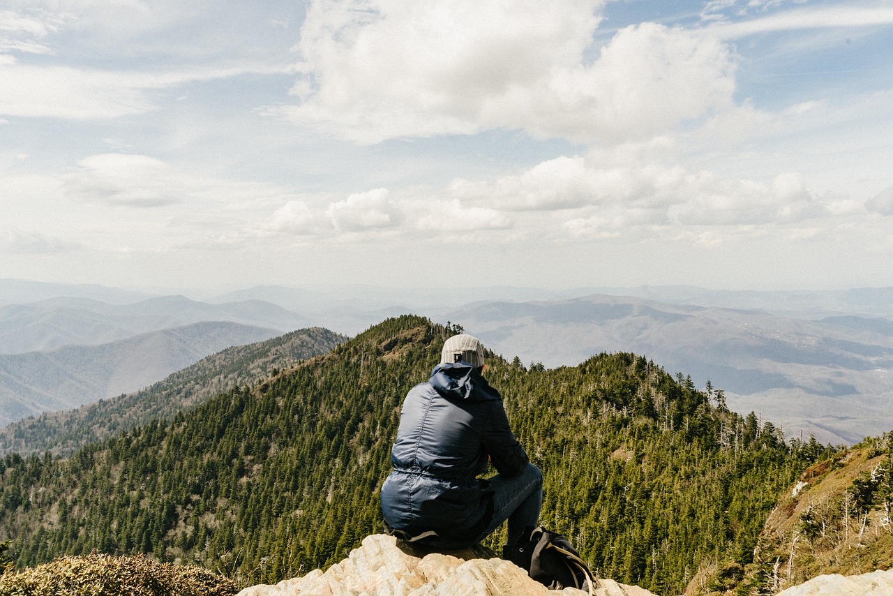 Solo hiker on a mountain top (photo: Pixabay).