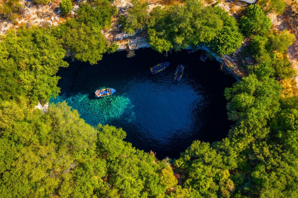 Famous Melissani lake on Kefalonia island, Karavomylos, Greece. On top of Melissani Cave (Melissani Lake) in Karavomylos village in Kefalonia island , Greece. Melissani Cave viewed from above.