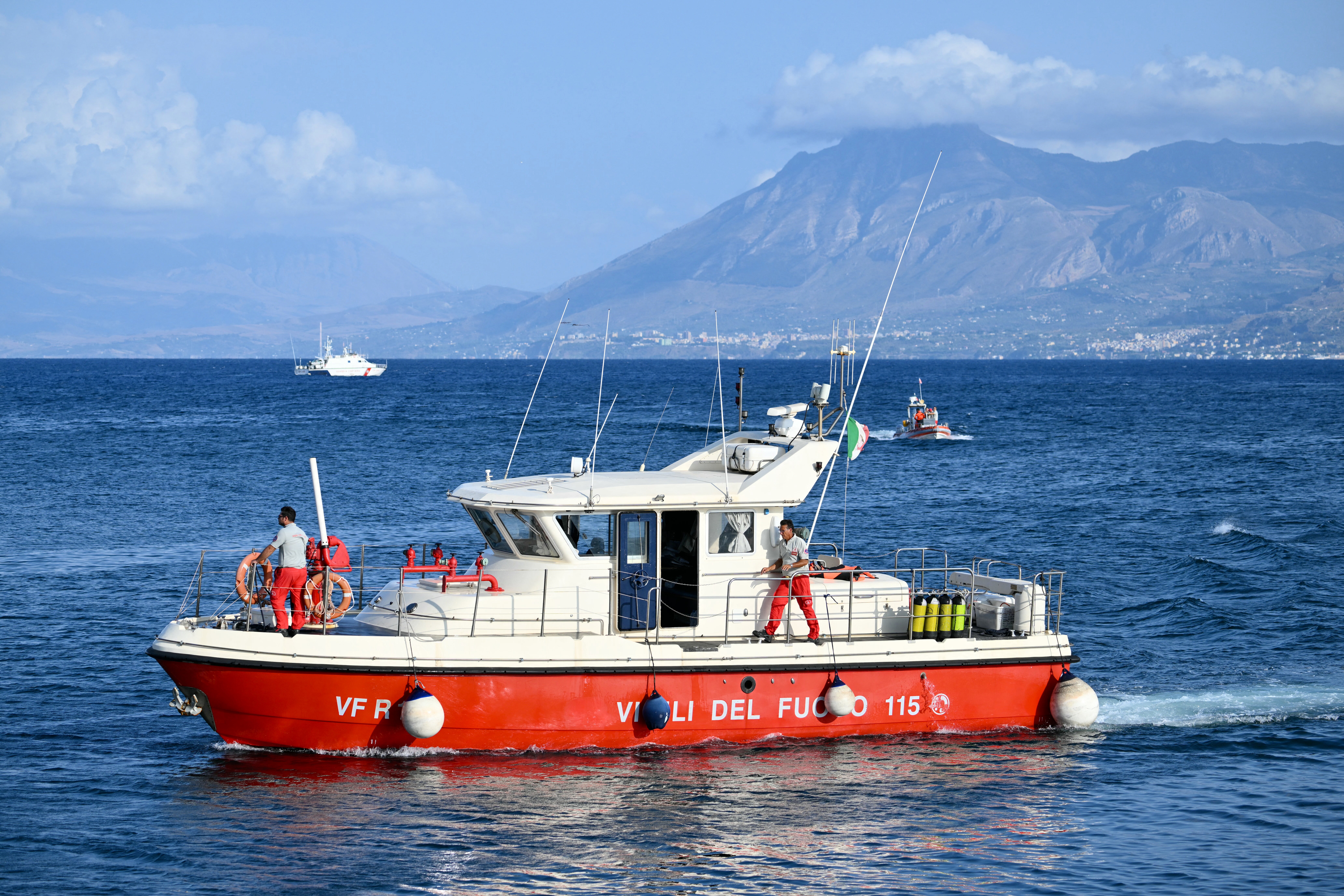 A rescue boat of the Vigili del Fuoco, the Italian Corps. of Firefighters operates off Porticello near Palermo, on August 20, 2024 a day after the British-flagged luxury yacht Bayesian sank