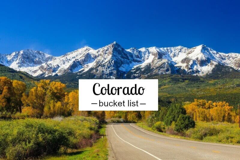 snow capped mountains on end of road in colorado