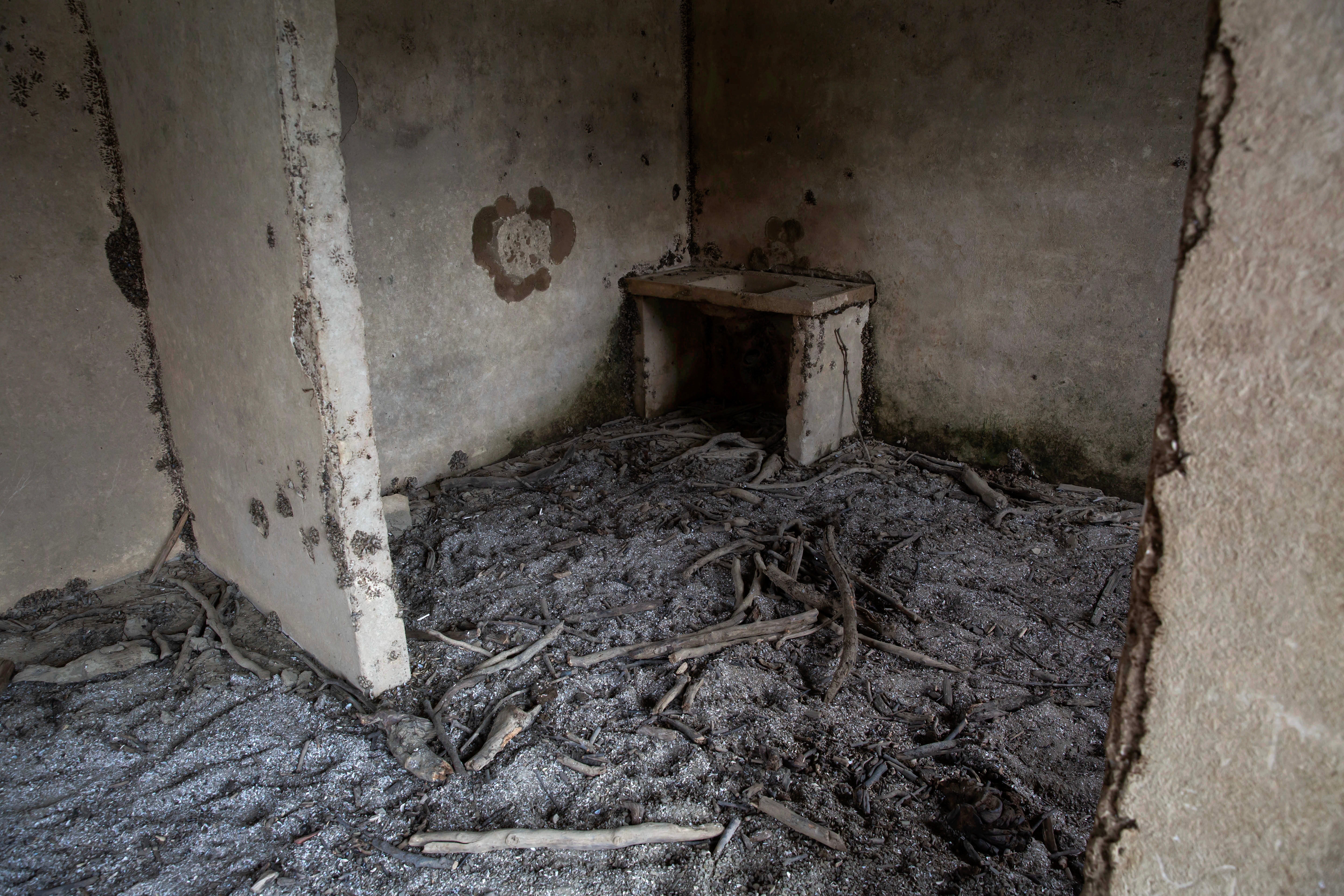 The interior of a house of the sunken village of Kallio, revealed due to the receding water level of Mornos artificial lake, near the village of Lidoriki in the prefecture of Fokida, about 240 km northwest of Athens, Greece