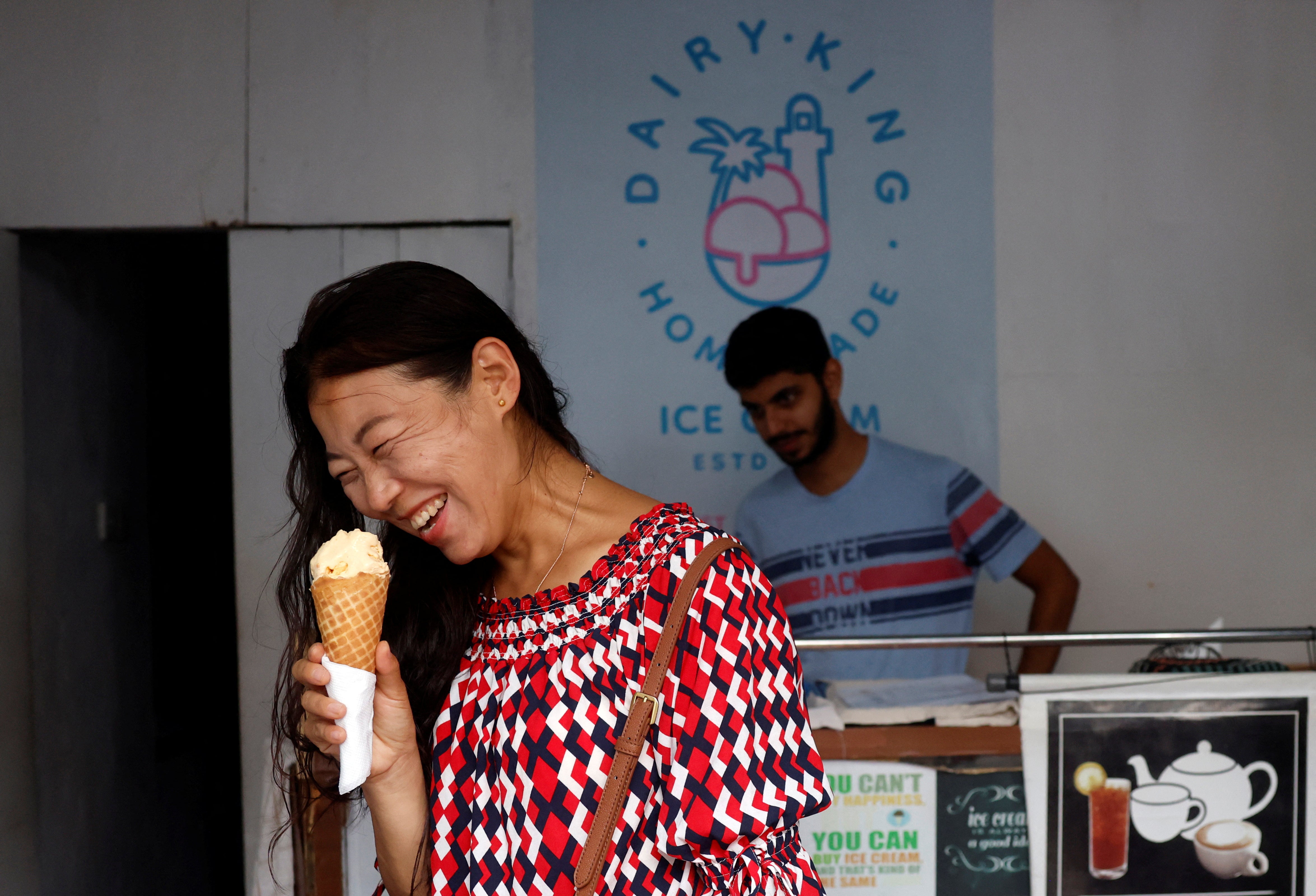 A foreigner enjoys ice cream at Diary King home-made ice cream shop, in Galle, Sri Lanka August 17, 2024