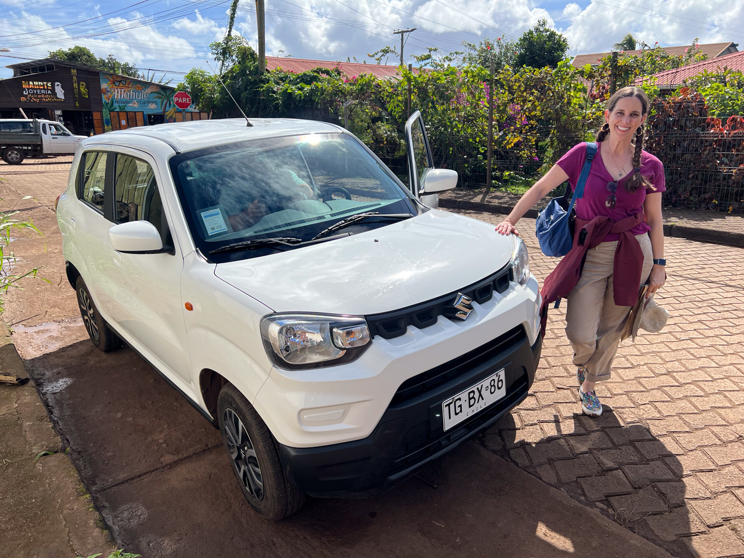 Kel picking up our Suzuki rental car in Hanga Roa.