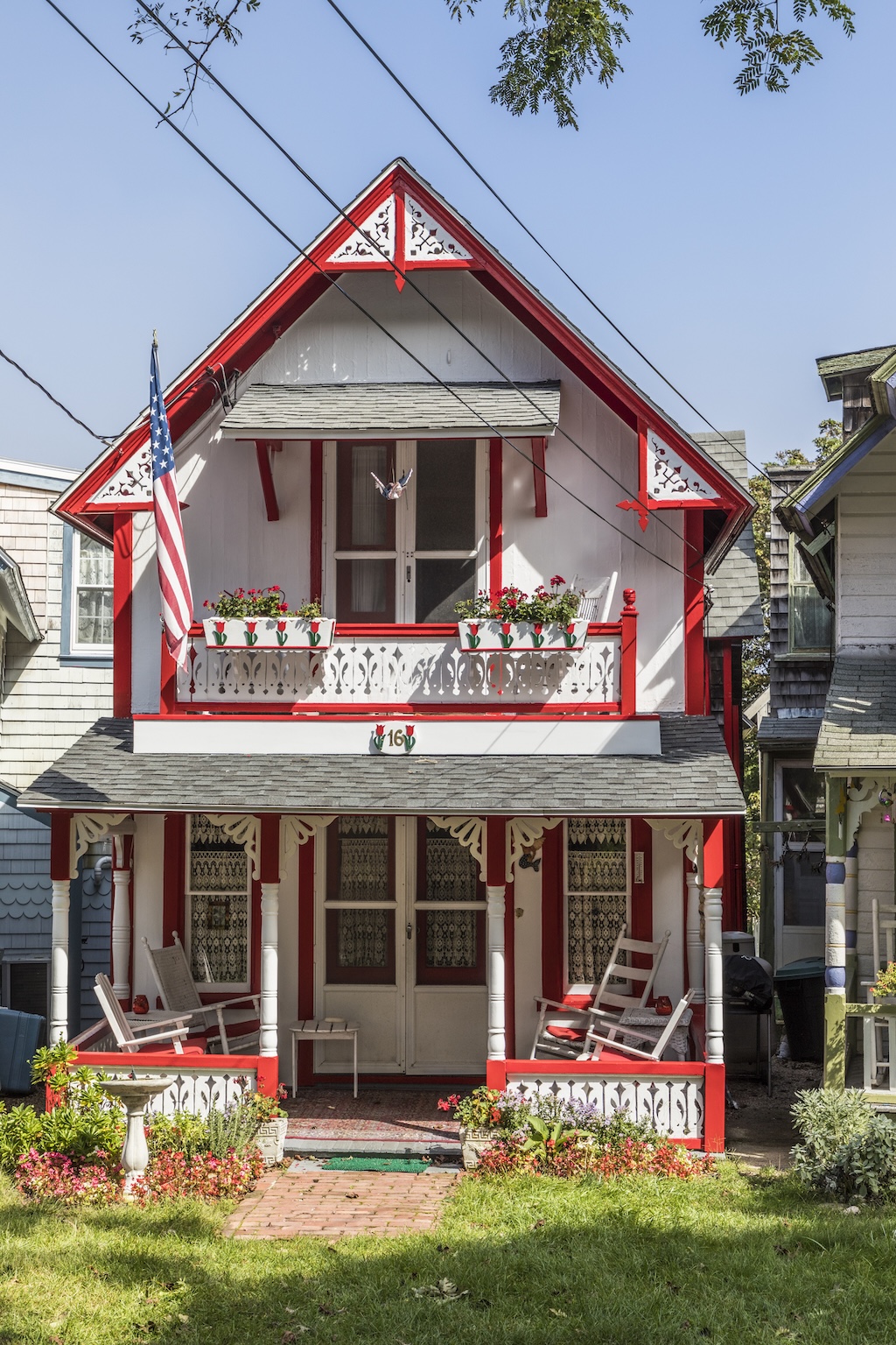 Carpenter Gothic Cottages with Victorian style, gingerbread trim on Lake Avenue, Oak Bluffs on Martha's Vineyard, Massachusetts, USA.