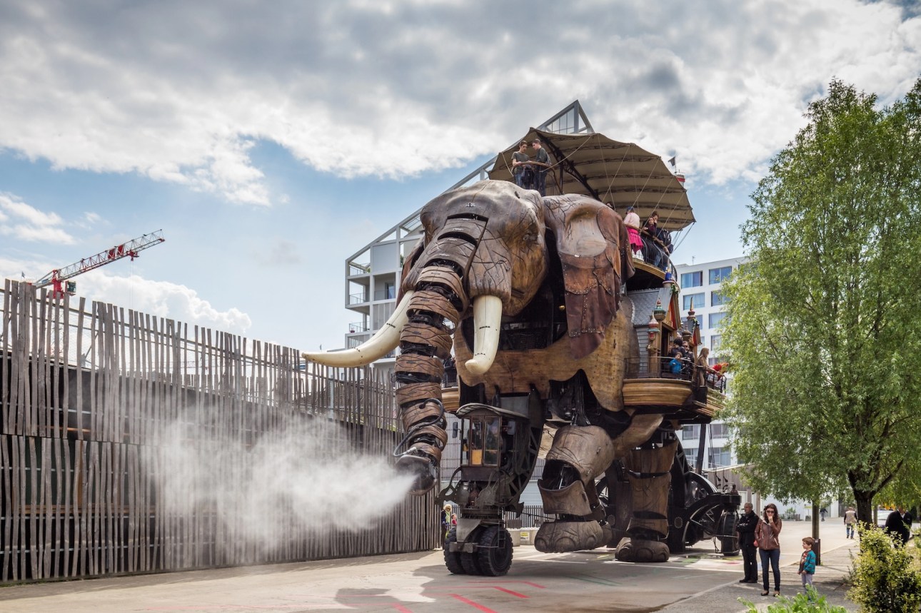 The Great Elephant is part of the Machines of the Isle of Nantes carrying passengers in city square in Nantes, France