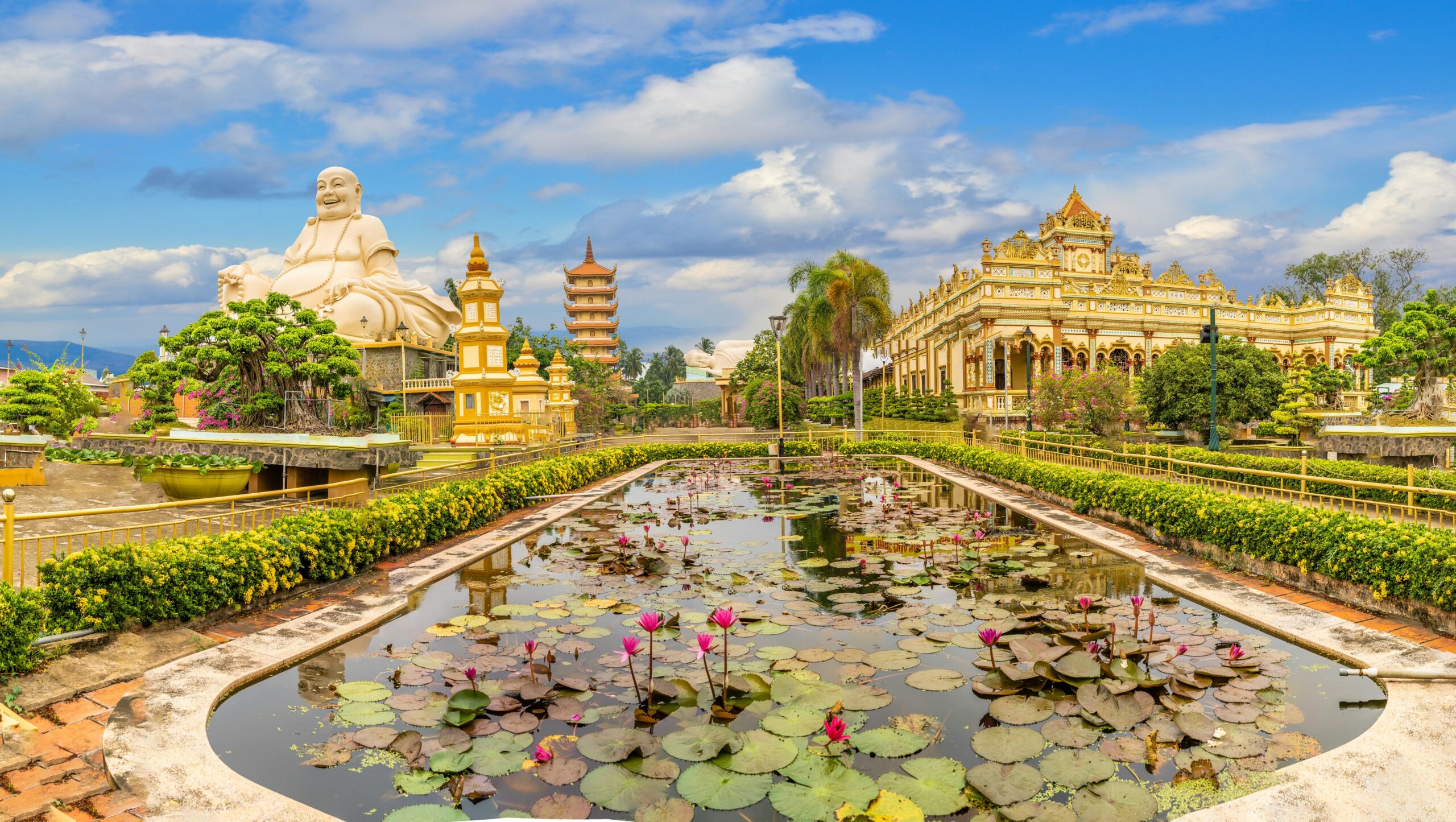 The grounds of Vinh Tranh Pagoda in My Tho, Vietnam, dominated by a giant Buddha statue.