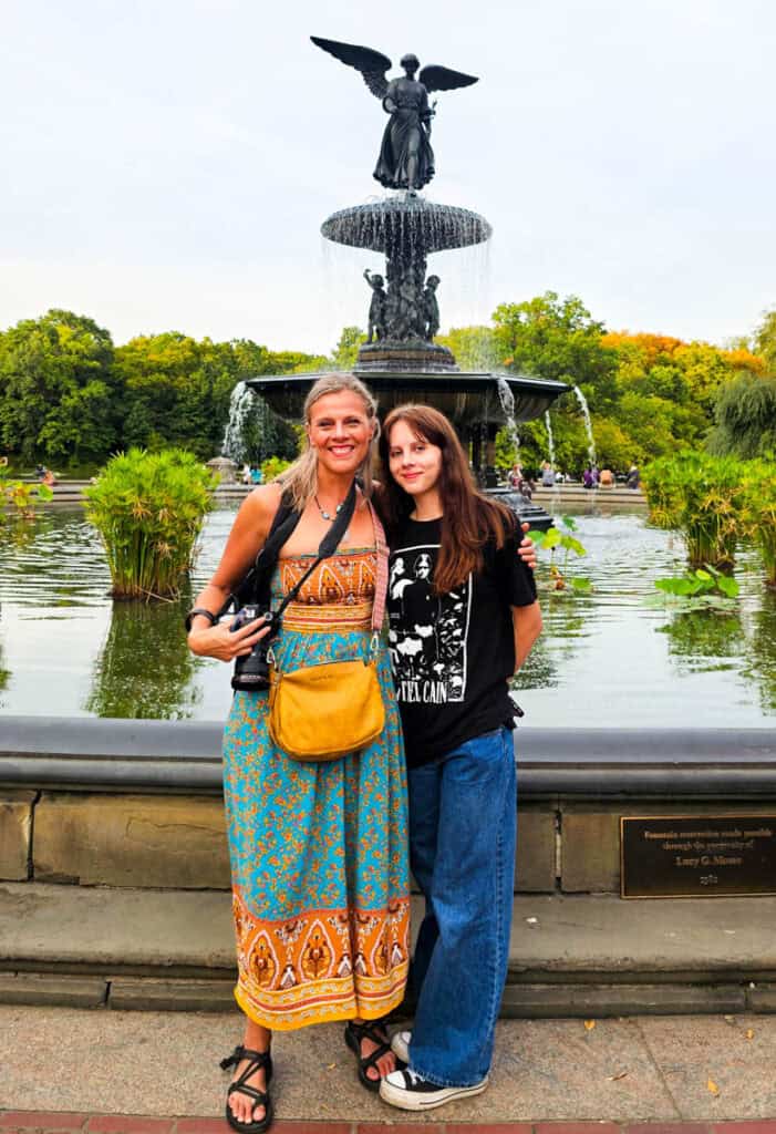 woman and daughter standing in front of Bethesda fountain central park