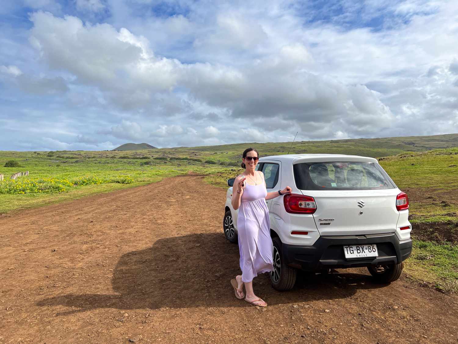 Kel with our rental car near Ovahe Beach on Easter Island.