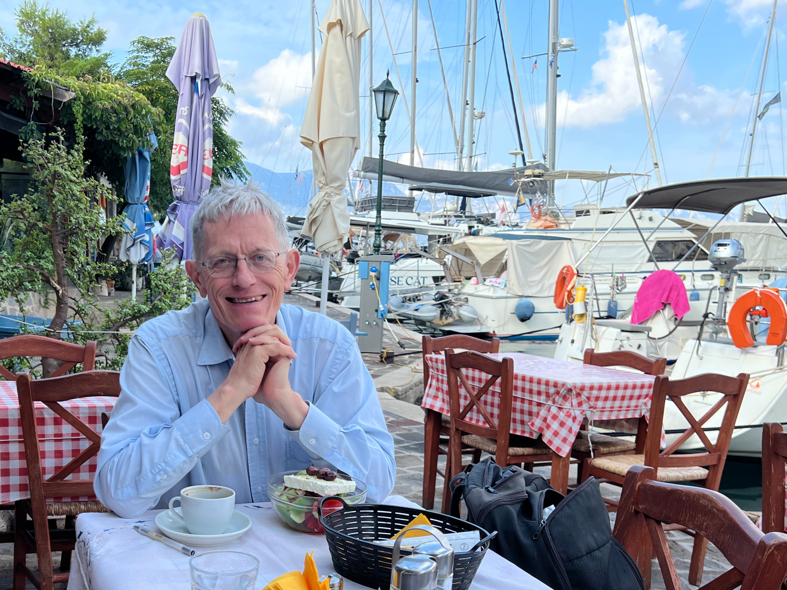 Day break: Simon Calder eating breakfast in the Greek fishing port of Vathi