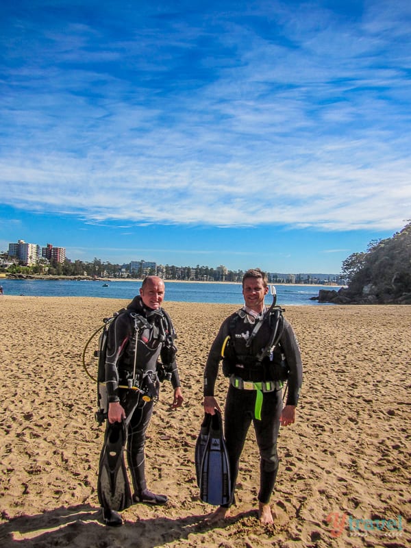 two men in scuba gear standing on shelley beach sydney