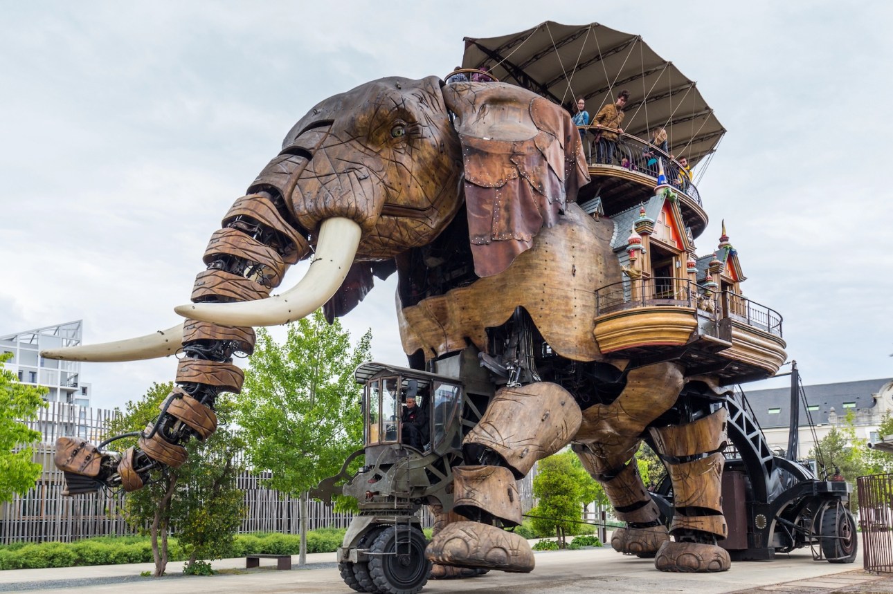 The Great Elephant is part of the Machines of the Isle of Nantes carrying passengers in city square in Nantes, France